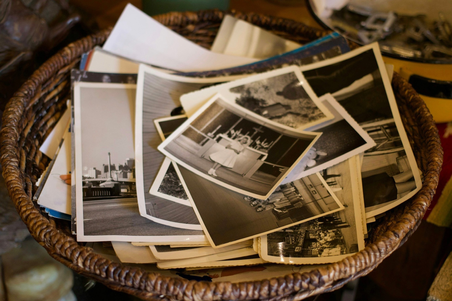 A basket of old black-and-white family photographs